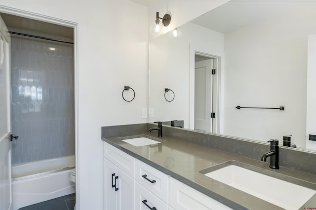 full bathroom featuring vanity, toilet, tile patterned floors, and tiled shower / bath