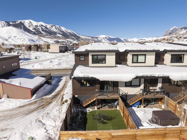 exterior space with a deck with mountain view