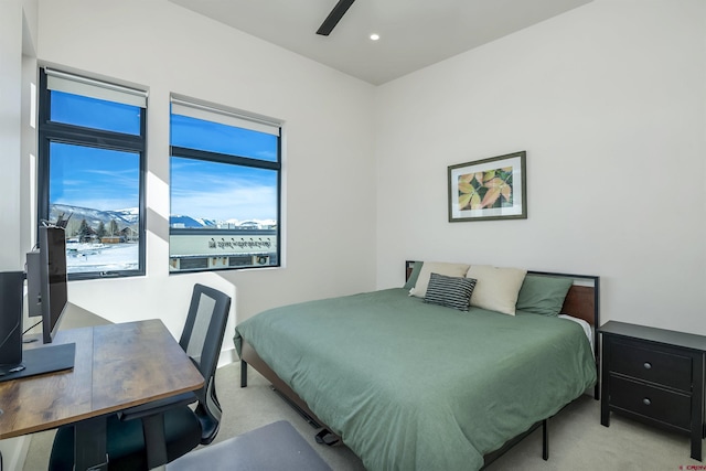 bedroom with light carpet and ceiling fan