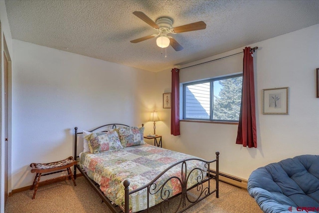 carpeted bedroom featuring a baseboard radiator, ceiling fan, and a textured ceiling