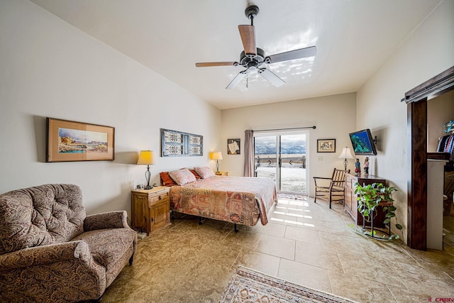 bedroom with access to outside and ceiling fan