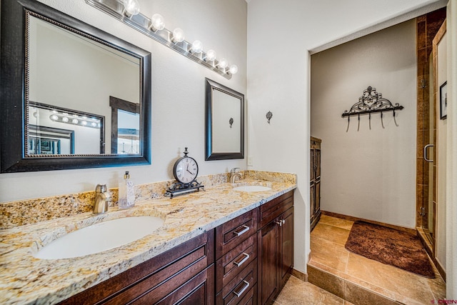 bathroom featuring walk in shower and vanity