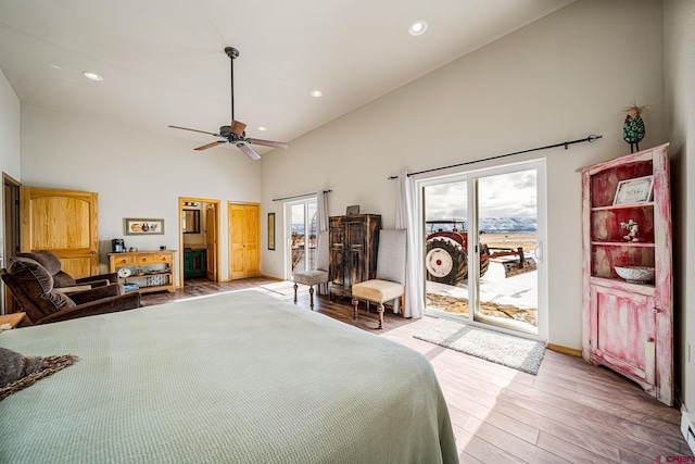 bedroom with access to exterior, light hardwood / wood-style flooring, high vaulted ceiling, and ceiling fan