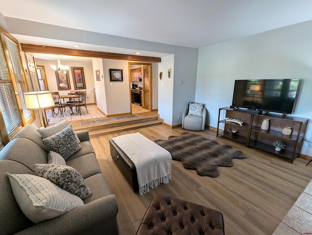 living room with an inviting chandelier and hardwood / wood-style flooring