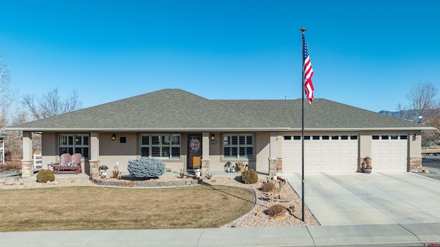 ranch-style house with a garage and a front lawn