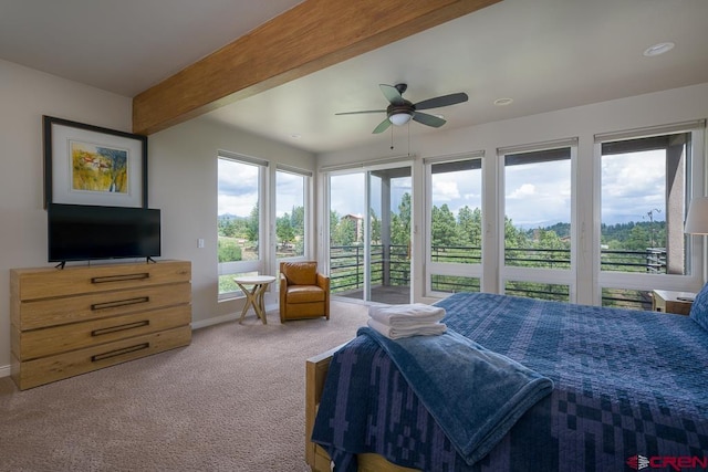 carpeted bedroom featuring ceiling fan, access to exterior, and beam ceiling