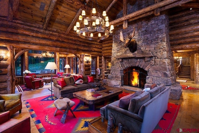 living room with an inviting chandelier, hardwood / wood-style floors, wood ceiling, and a stone fireplace