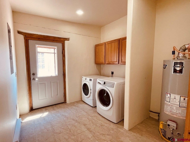 washroom with independent washer and dryer, cabinets, and gas water heater