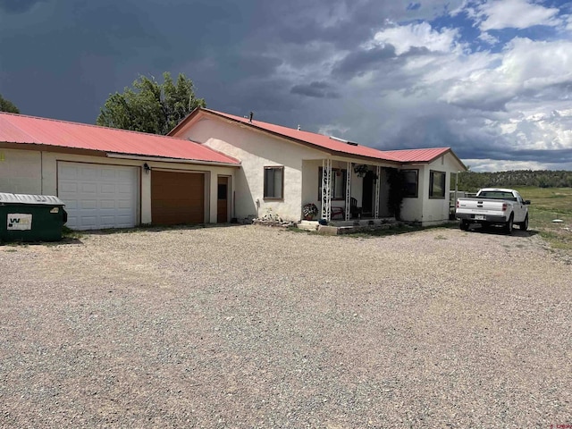 view of front of property with a garage and a porch