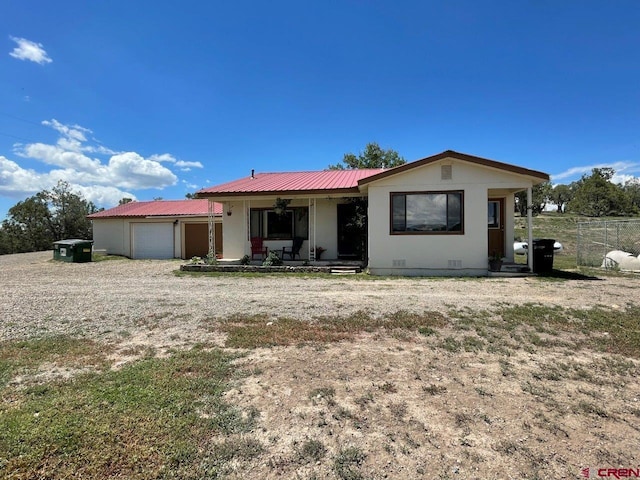 view of front of house with a garage and a porch