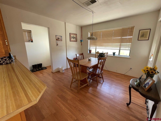 dining area featuring hardwood / wood-style floors