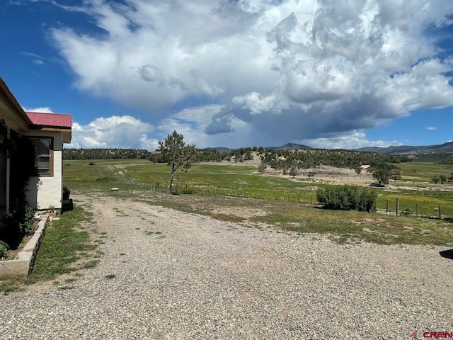 view of street featuring a mountain view and a rural view