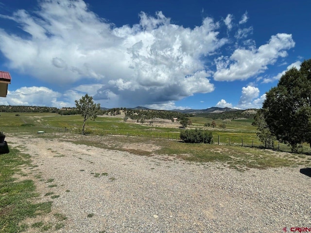 exterior space featuring a rural view and a mountain view