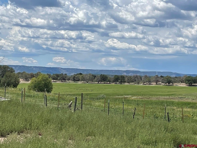 property view of mountains featuring a rural view