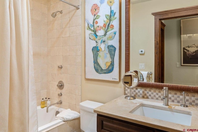 full bathroom featuring tasteful backsplash, shower / bath combo, vanity, and toilet