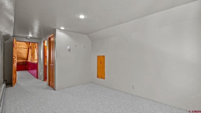 bonus room with a baseboard radiator, lofted ceiling, and carpet