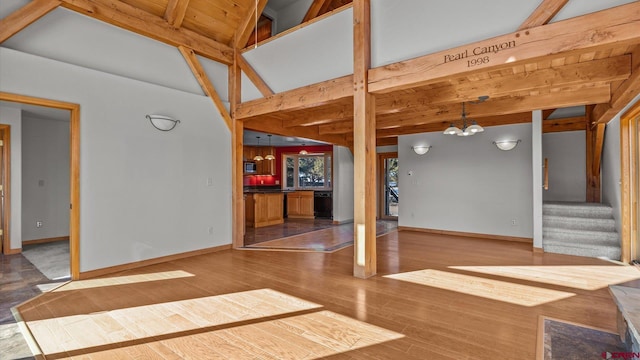 interior space featuring wood-type flooring and a chandelier