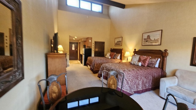 carpeted bedroom featuring a high ceiling