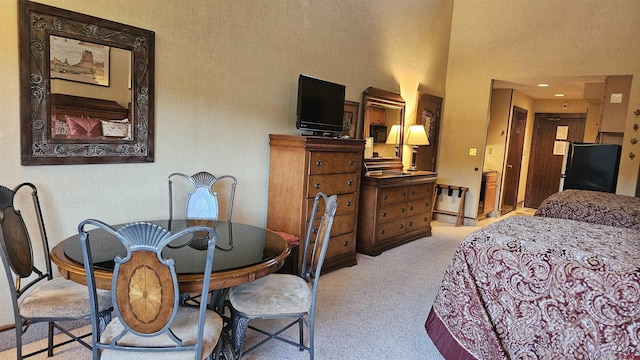 bedroom featuring light carpet