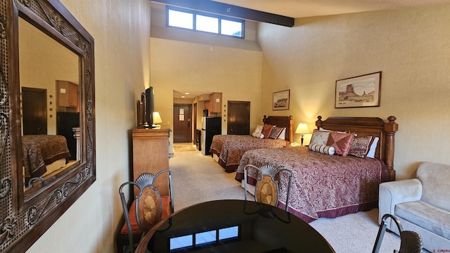 carpeted bedroom with beamed ceiling and a high ceiling