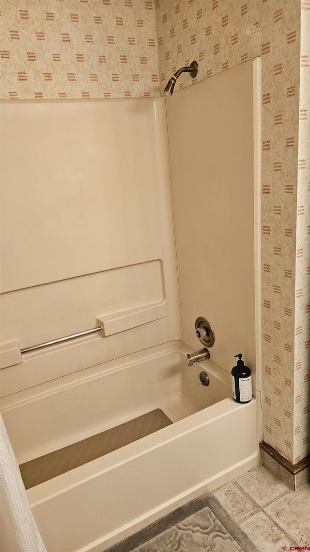 bathroom with tile patterned flooring and shower / bath combination with curtain