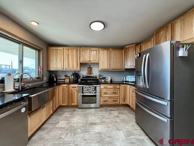 kitchen featuring stainless steel appliances and sink