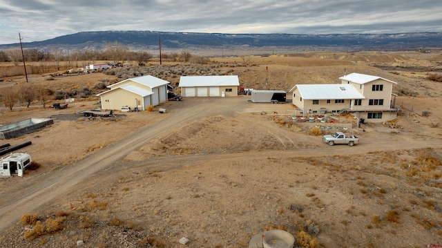 birds eye view of property featuring a mountain view and a rural view