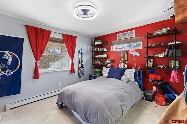 bedroom with carpet flooring, multiple windows, and a baseboard heating unit