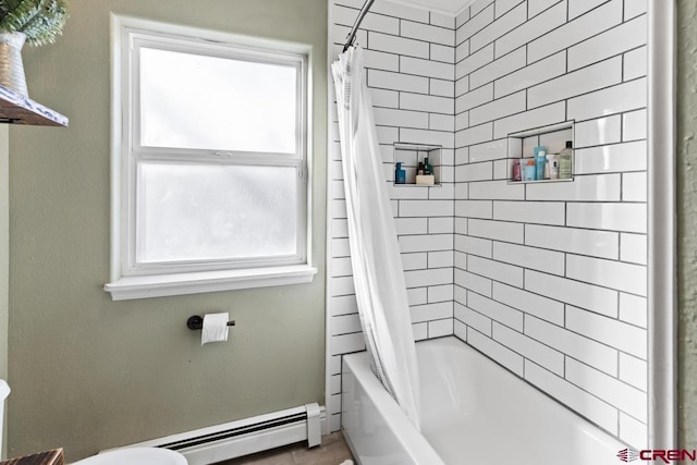 bathroom featuring a baseboard heating unit, plenty of natural light, toilet, and shower / bath combo