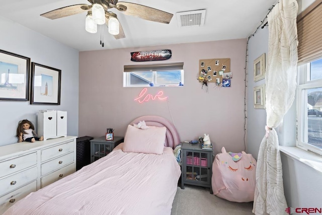 carpeted bedroom featuring ceiling fan