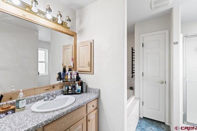 bathroom with vanity and an enclosed shower