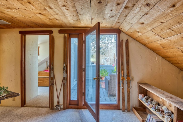 interior space with lofted ceiling, wood ceiling, light carpet, and french doors