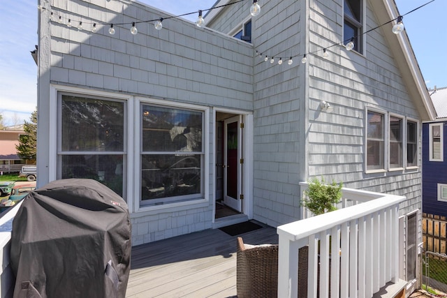 wooden terrace with area for grilling