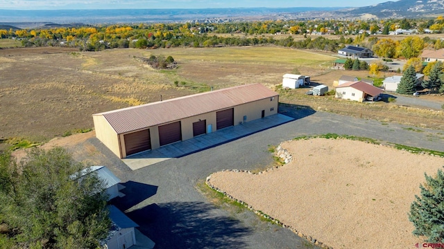 drone / aerial view featuring a mountain view