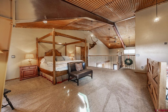 unfurnished bedroom with carpet floors and high vaulted ceiling