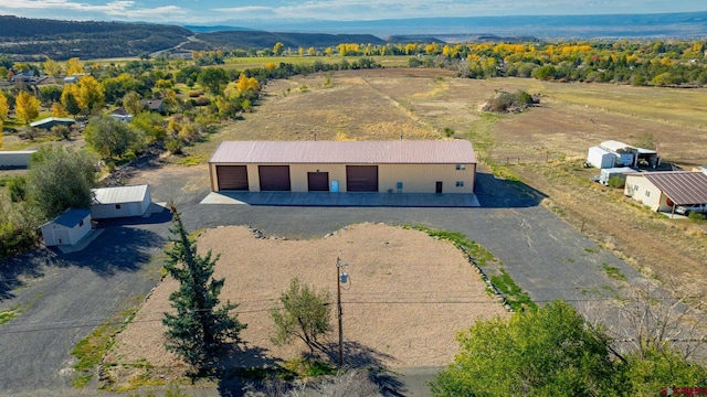 birds eye view of property featuring a mountain view