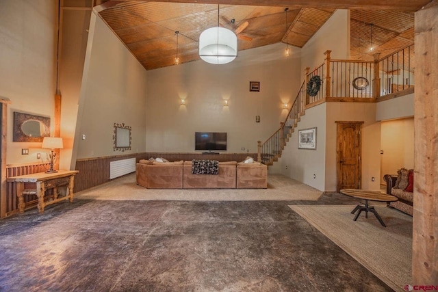 living room with a towering ceiling