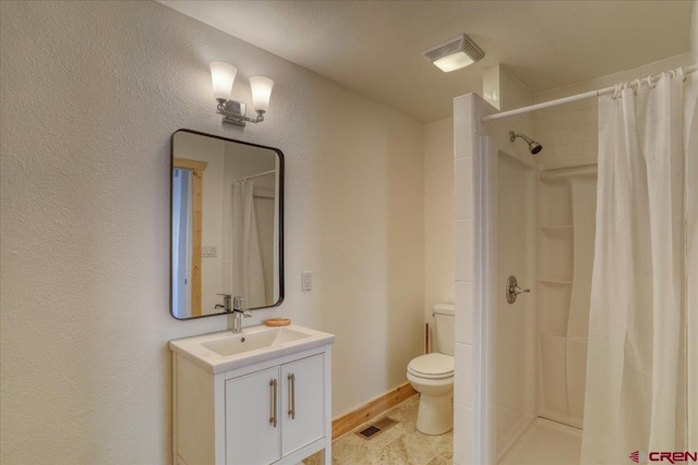 bathroom with vanity, a shower with curtain, and toilet