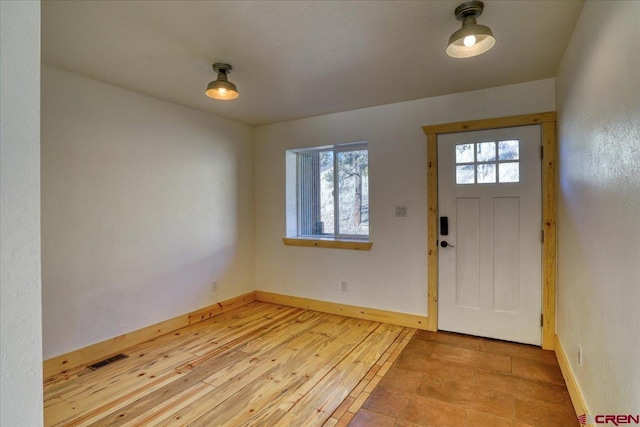 entrance foyer featuring light hardwood / wood-style floors