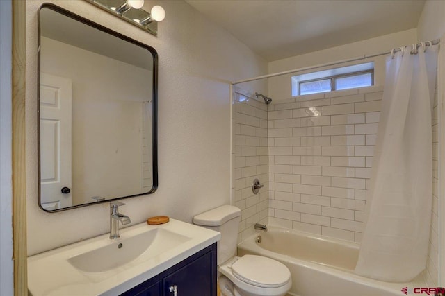 full bathroom with shower / tub combo, vanity, and toilet