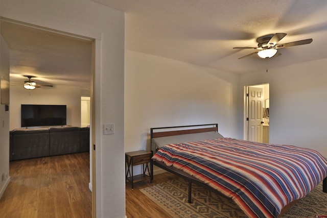 bedroom featuring dark wood-type flooring and ceiling fan