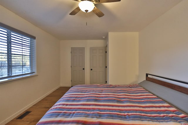 bedroom featuring hardwood / wood-style floors and ceiling fan