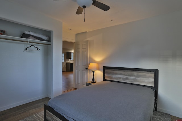 bedroom featuring dark wood-type flooring and ceiling fan