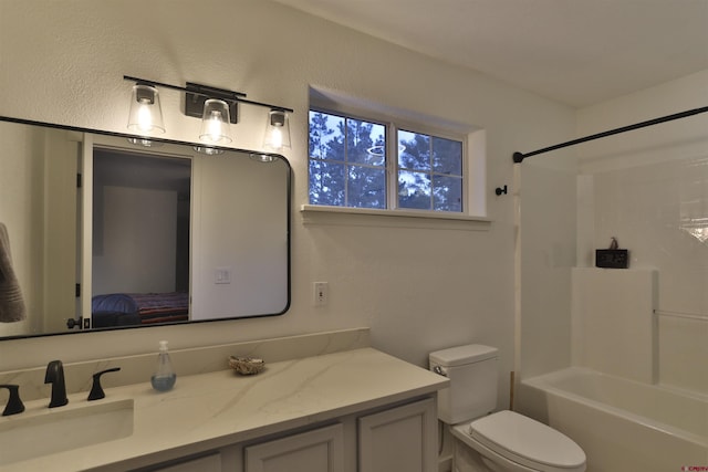 full bathroom with vanity, shower / bathtub combination, and toilet