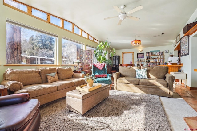 living room with ceiling fan and lofted ceiling