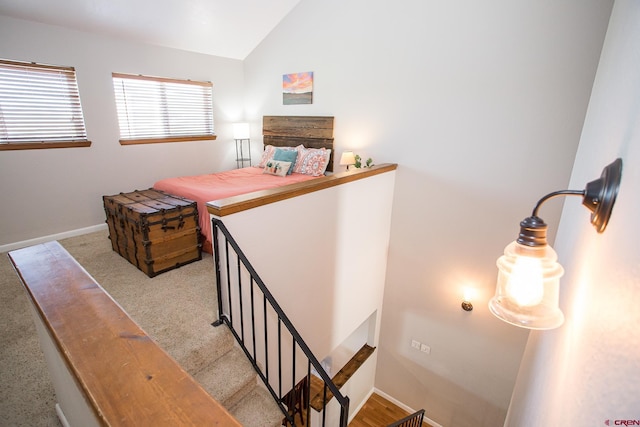 stairs featuring lofted ceiling