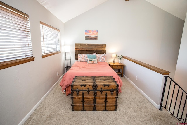 carpeted bedroom featuring vaulted ceiling