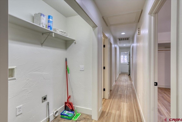 laundry area featuring hardwood / wood-style flooring and hookup for an electric dryer