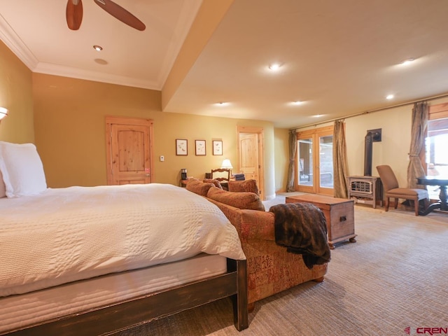 bedroom featuring crown molding, a wood stove, ceiling fan, and carpet flooring