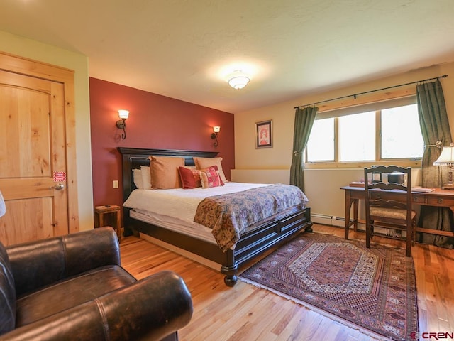 bedroom with hardwood / wood-style floors